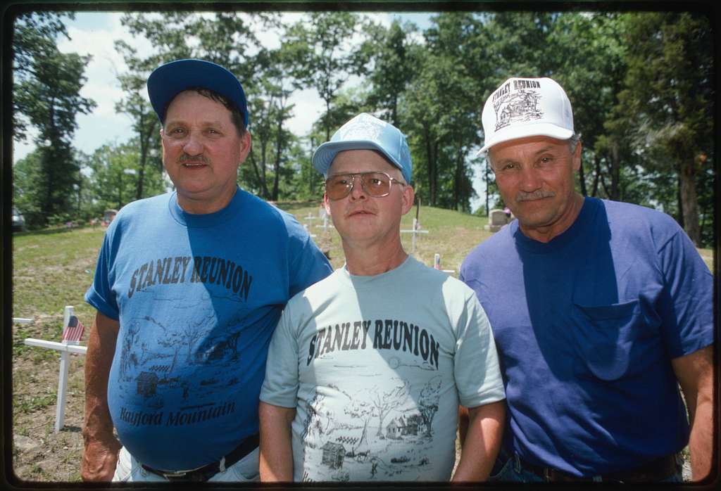 Larry Gibson, center, with two unidentified friends, wearing Stanley Reunion t-shirts and hats
